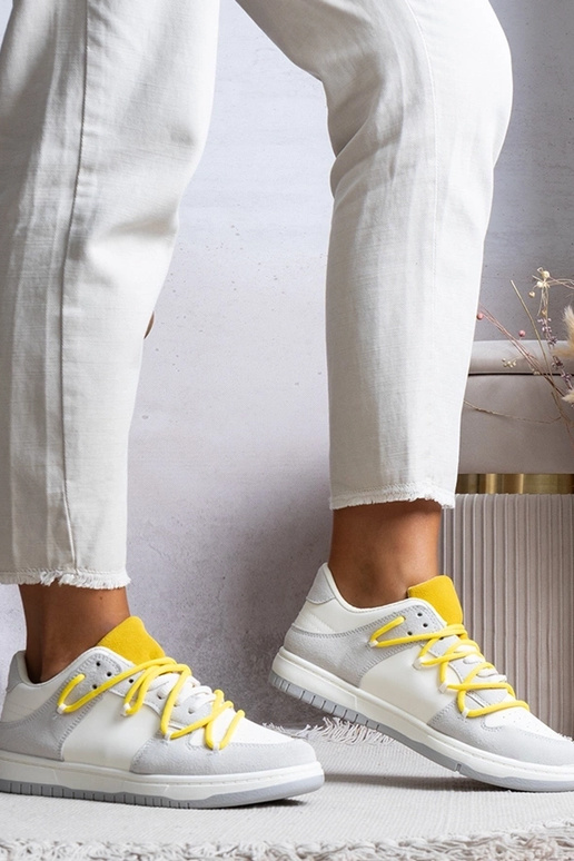 Graue Damen-Sneaker mit gelben... Graue Damen-Sneaker mit gelben...