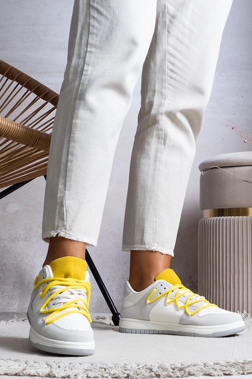 Graue Damen-Sneaker mit gelben... Graue Damen-Sneaker mit gelben...