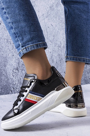 Schwarze Schuhe mit... 2