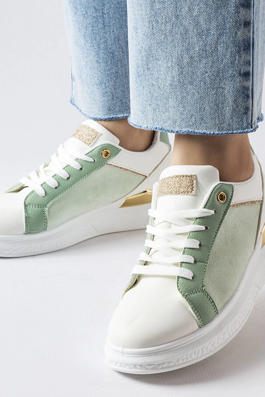 Weiße und grüne Schuhe mit goldenem...