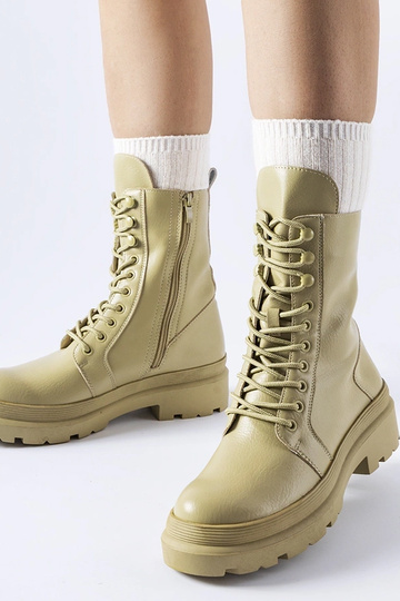 Grüne flache Stiefel mit...