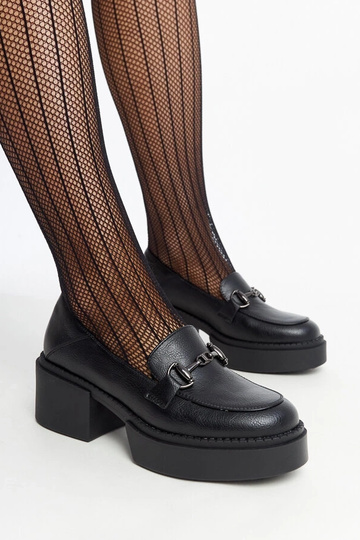 Schwarze Stöckelschuhe aus...