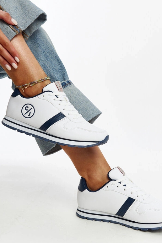 Weiße und marineblaue Damen-Sneakers...