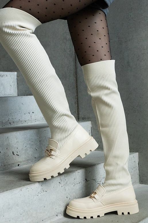 Hellbeige Stiefel mit elastischem... Hellbeige Stiefel mit elastischem...