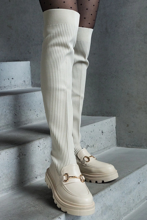 Hellbeige Stiefel mit elastischem... Hellbeige Stiefel mit elastischem...