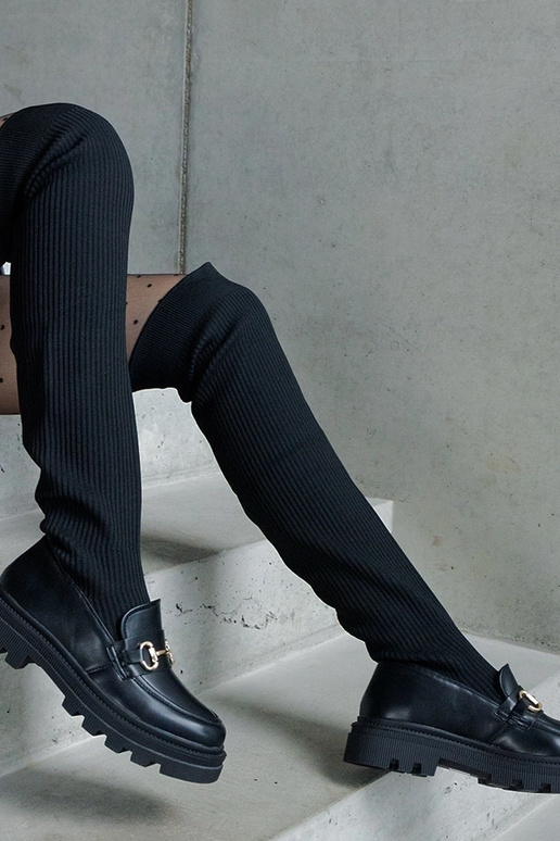 Schwarze Stiefel mit elastischem... Schwarze Stiefel mit elastischem...