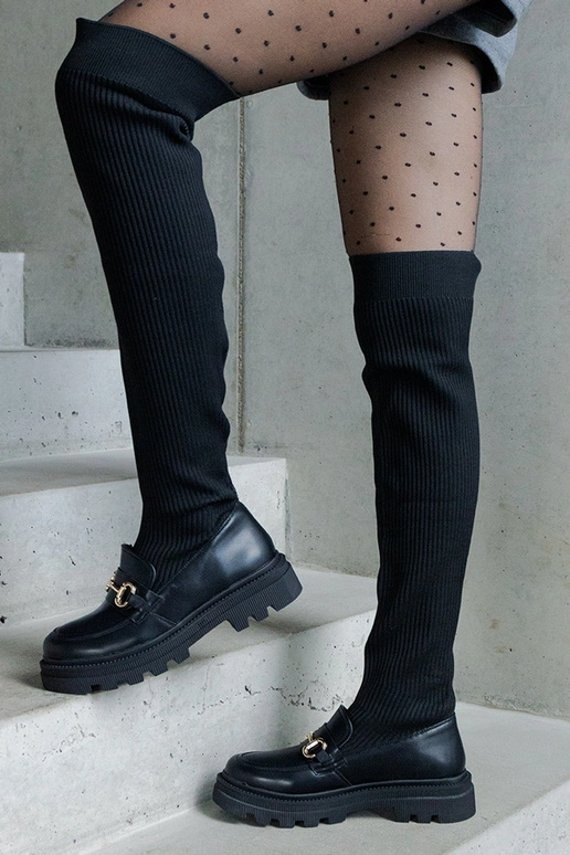 Schwarze Stiefel mit elastischem... Schwarze Stiefel mit elastischem...