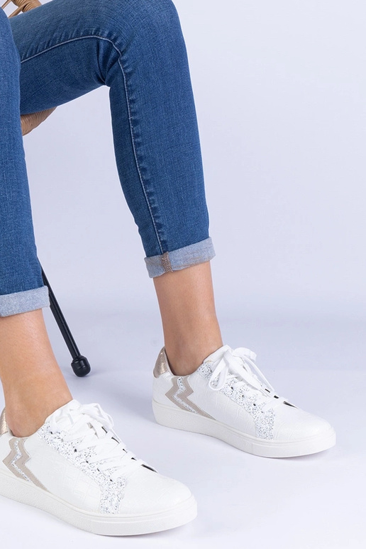 Weiße Damen Sneaker mit Prägung und... Weiße Damen Sneaker mit Prägung und...