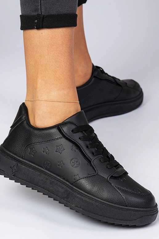 Schwarze Sportschuhe aus Kunstleder...