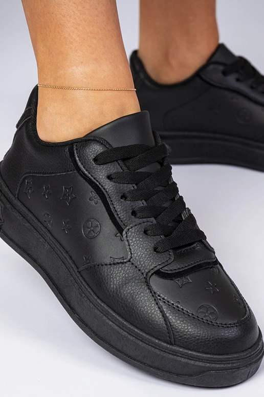 Schwarze Sportschuhe aus Kunstleder...