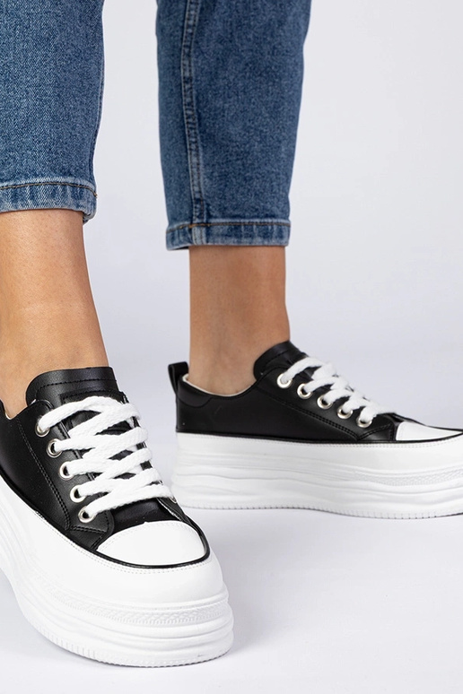 Schwarz-weiße Damen Sneakers mit... Schwarz-weiße Damen Sneakers mit...