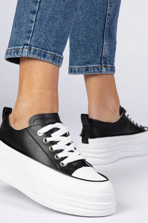 Schwarz-weiße Damen Sneakers mit... Schwarz-weiße Damen Sneakers mit...