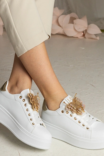 Weiß-goldene Sneakers mit...