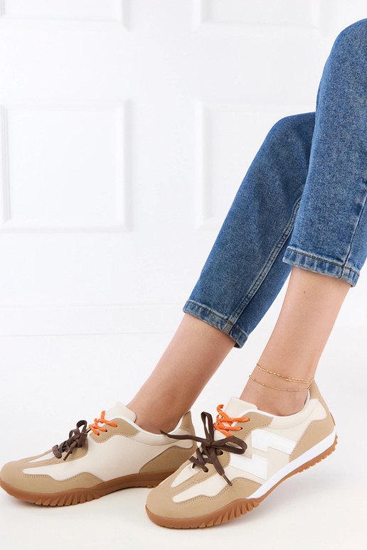 Sandfarbene Sportschuhe mit bunten...