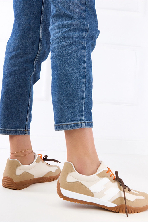 Sandfarbene Sportschuhe mit bunten...