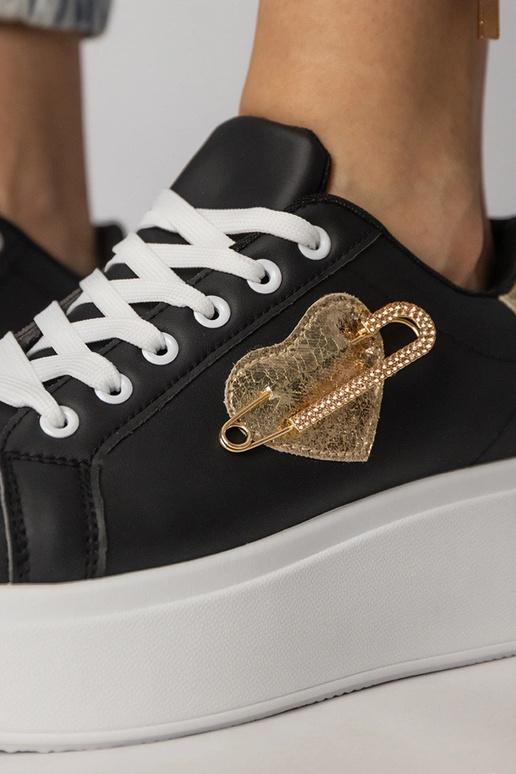 Schwarze Sportschuhe mit herzförmigem...