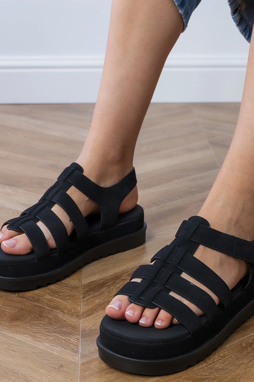 Schwarze Gladiatorensandalen auf...