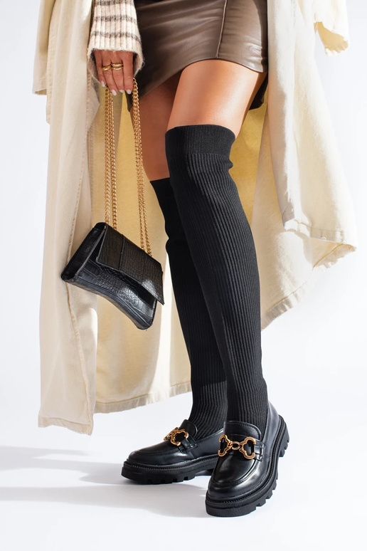 Schwarze Stiefeletten mit flexiblem... Schwarze Stiefeletten mit flexiblem...