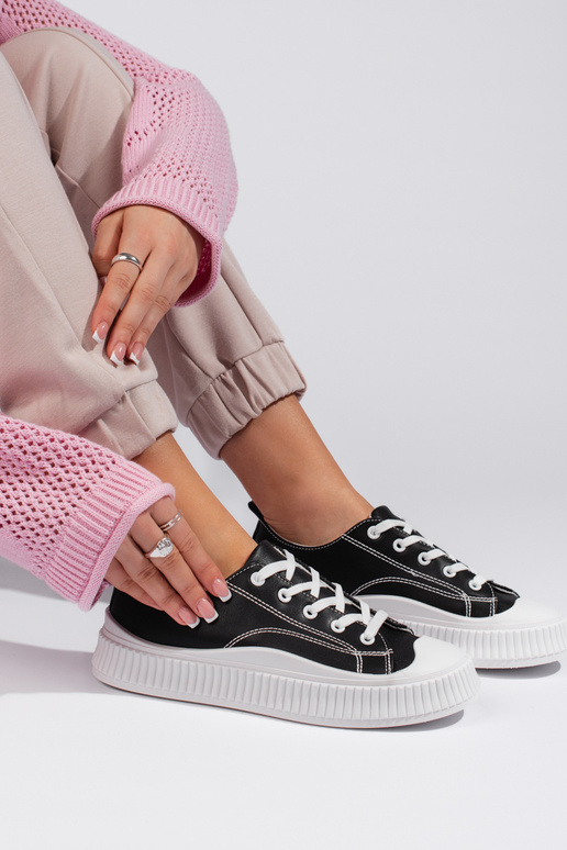 Schwarze klassische Damen-Sneakers... Schwarze klassische Damen-Sneakers...