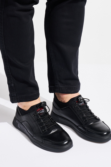 schwarze Sportschuhe für... 2