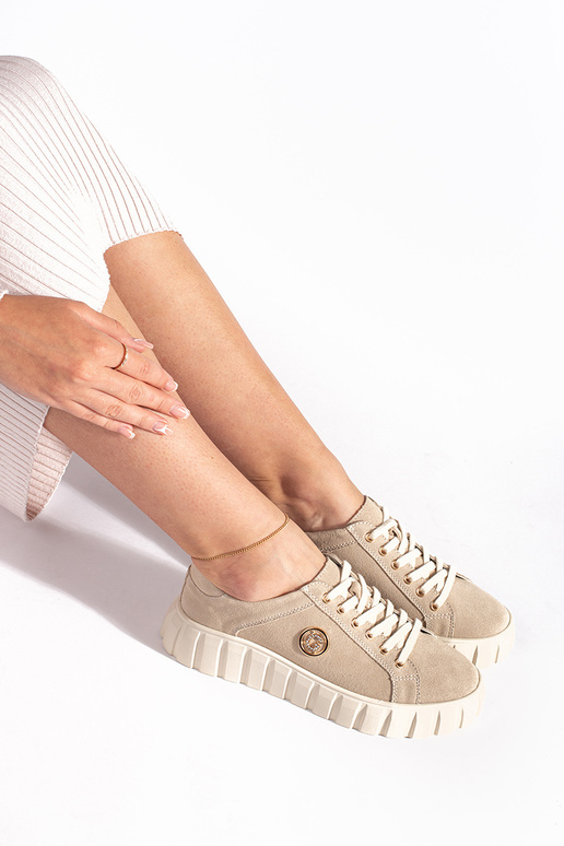 Elfenbeinfarbene Stiefeletten mit... Elfenbeinfarbene Stiefeletten mit...