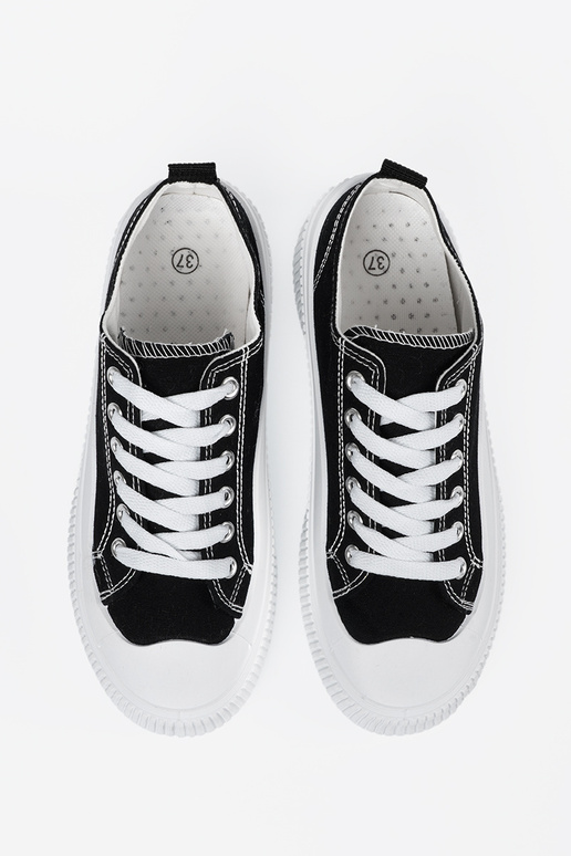 Schwarz-weiße Sneakers mit dicker Sohle