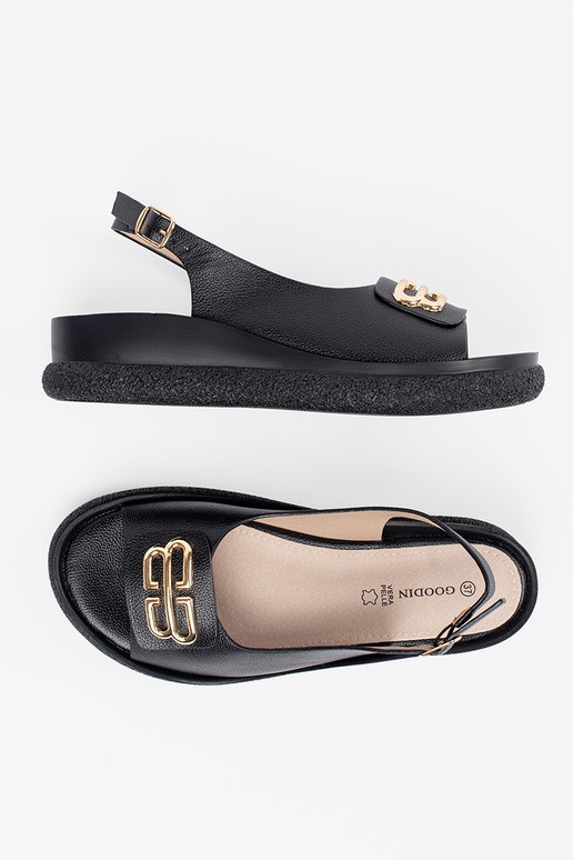 Flache schwarze Sandalen mit Dekoration