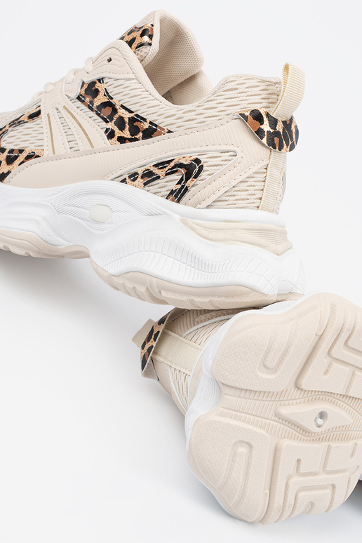 Sandfarbene Sportschuhe im Stil mit...