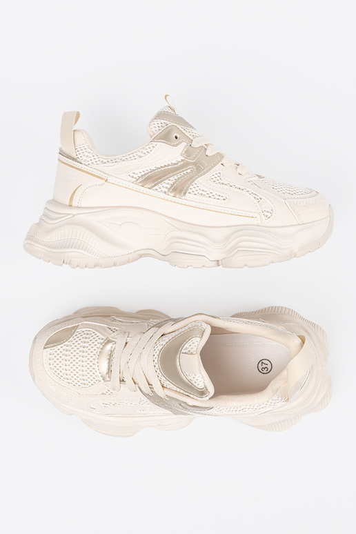 Elfenbeinfarbene Sportschuhe auf...