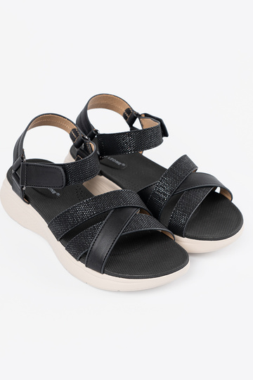 Braune Sandalen auf weißer... 2
