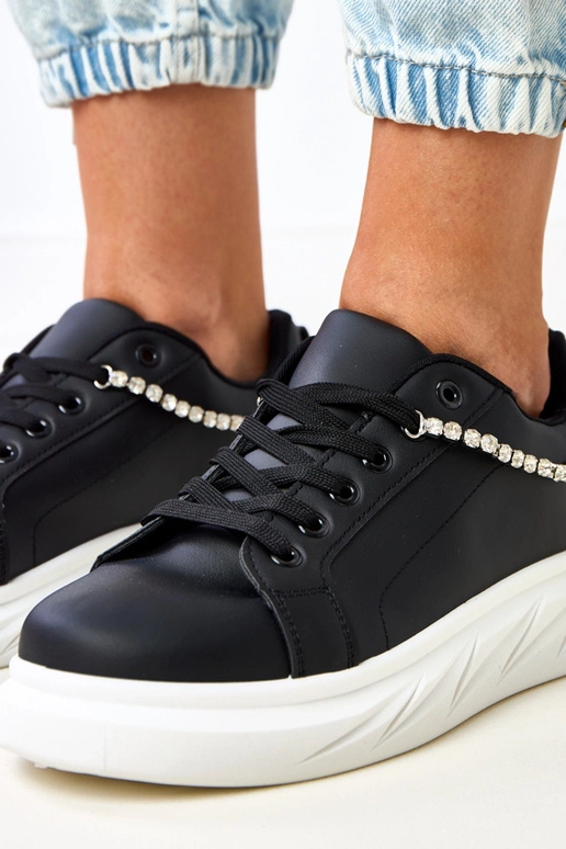 Schwarze Sneakers auf Plattform mit... Schwarze Sneakers auf Plattform mit...