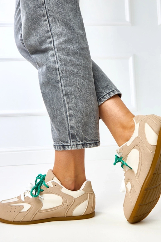 Beige Sportschuhe mit doppelten... Beige Sportschuhe mit doppelten...