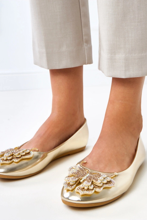 Goldene Ballerinas mit dekorativem... Goldene Ballerinas mit dekorativem...