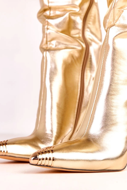 Goldene elegante kniehohe Stiefel mit... Goldene elegante kniehohe Stiefel mit...