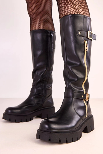 Schwarze kniehohe Stiefel auf Plattform mit goldfarbener Verzierung Makia