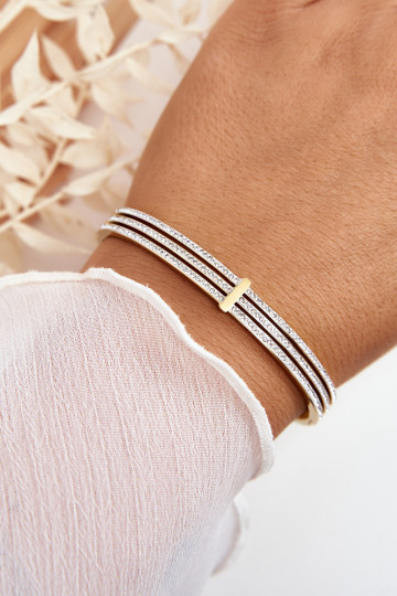 Ein Armband aus Edelstahl mit blitzenden Augen goldene Farbe