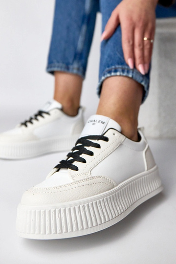Schwarz-weiße Sport-Sneaker auf Plattform Solange 2