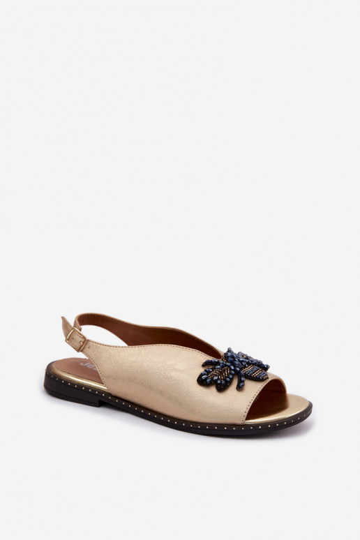 Sandalen mit Glanz und Ornamenten in flachem Gold Russona