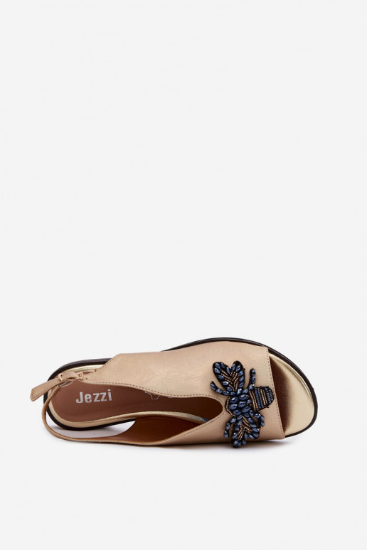Sandalen mit Glanz und Ornamenten in flachem Gold Russona