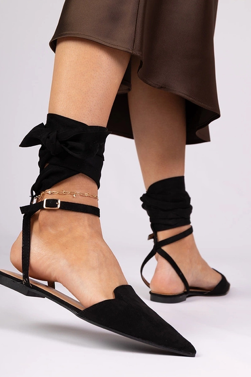 Schwarze Mules mit flachem Absatz Mella