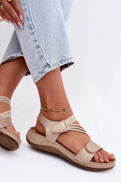 Goldene Damen-Sandalen mit elastischen Riemen