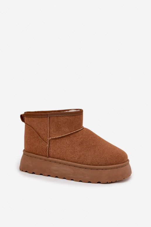 Sandfarbene Schuhe mit schwarzen Akzenten und dicker Sohle