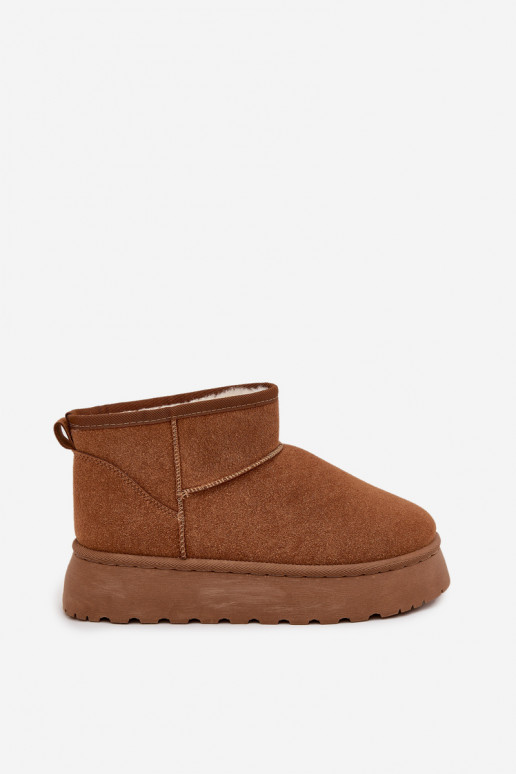 Sandfarbene Schuhe mit schwarzen Akzenten und dicker Sohle