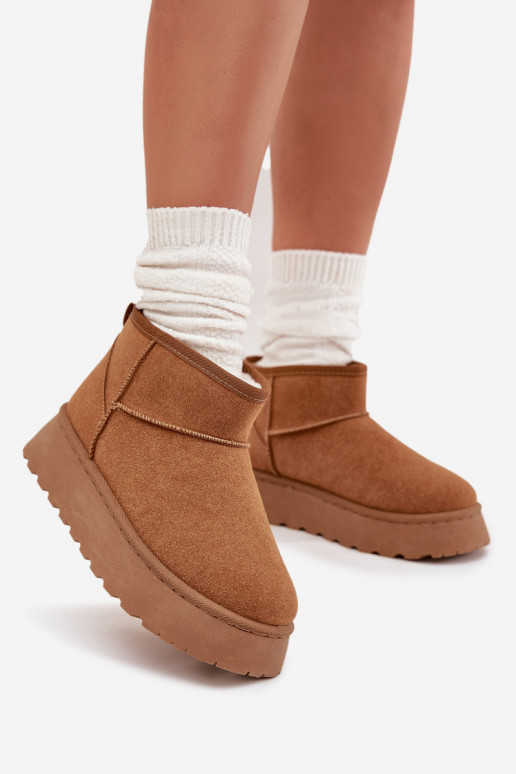 Sandfarbene Schuhe mit schwarzen Akzenten und dicker Sohle