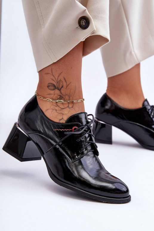 Lackierte Stiefeletten mit Absatz in... Lackierte Stiefeletten mit Absatz in...